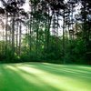 A sunny view of a green at Texas National GC