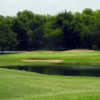 A view of a green surrounded by bunkers at Thorntree Country Club.