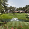 A view of a tee and the clubhouse in the distance at Oak Hills Country Club.