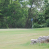 A sunny day view of a hole at Cowan Creek Golf Course.