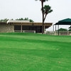 A view of the clubhouse with green in foreground at Willow Springs Golf Course