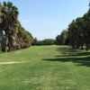 A view of fairway #1 with palm trees on both sides at El Nino Course from Mission West RV Park.