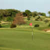 A sunny day view of a green at Vaquero Club.
