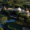 Aerial view of the clubhouse and 18th green at Dominion Country Club